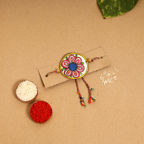  Handpainted Tholu Bommalata Leather Rakhi 