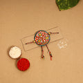  Handpainted Tholu Bommalata Leather Rakhi 