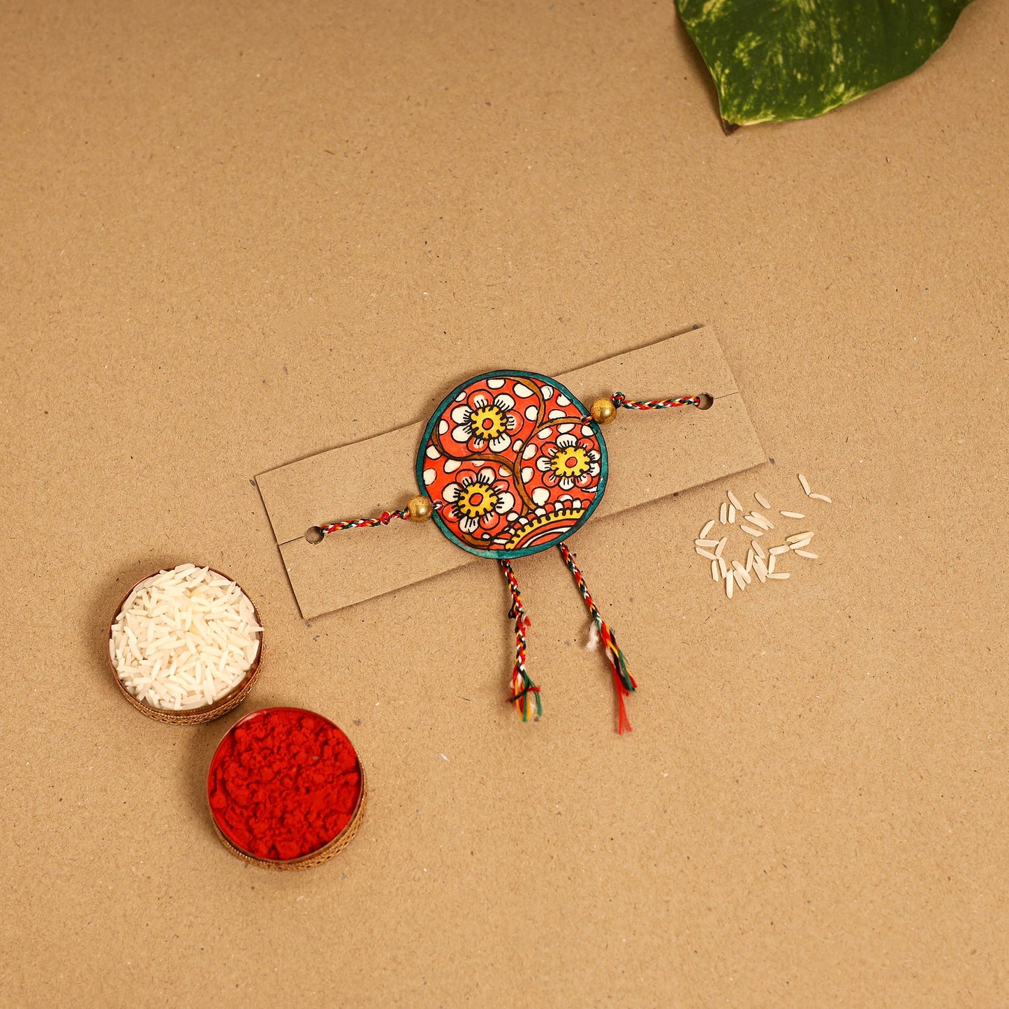  Handpainted Tholu Bommalata Leather Rakhi 