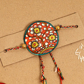  Handpainted Tholu Bommalata Leather Rakhi 