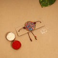  Handpainted Tholu Bommalata Leather Rakhi 