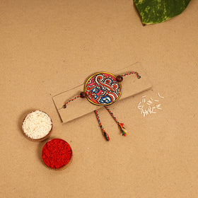  Handpainted Tholu Bommalata Leather Rakhi 