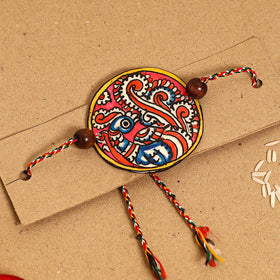  Handpainted Tholu Bommalata Leather Rakhi 