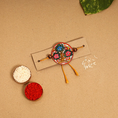 Handpainted Tholu Bommalata Leather Rakhi 