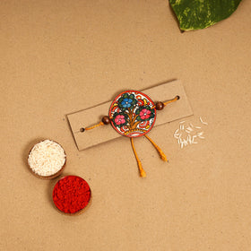  Handpainted Tholu Bommalata Leather Rakhi 