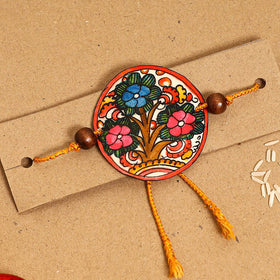 Handpainted Tholu Bommalata Leather Rakhi 