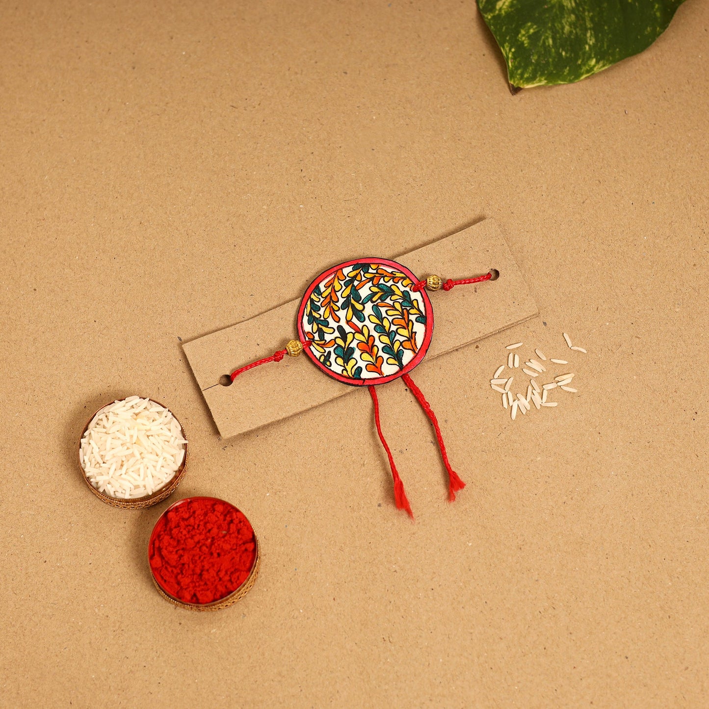  Handpainted Tholu Bommalata Leather Rakhi