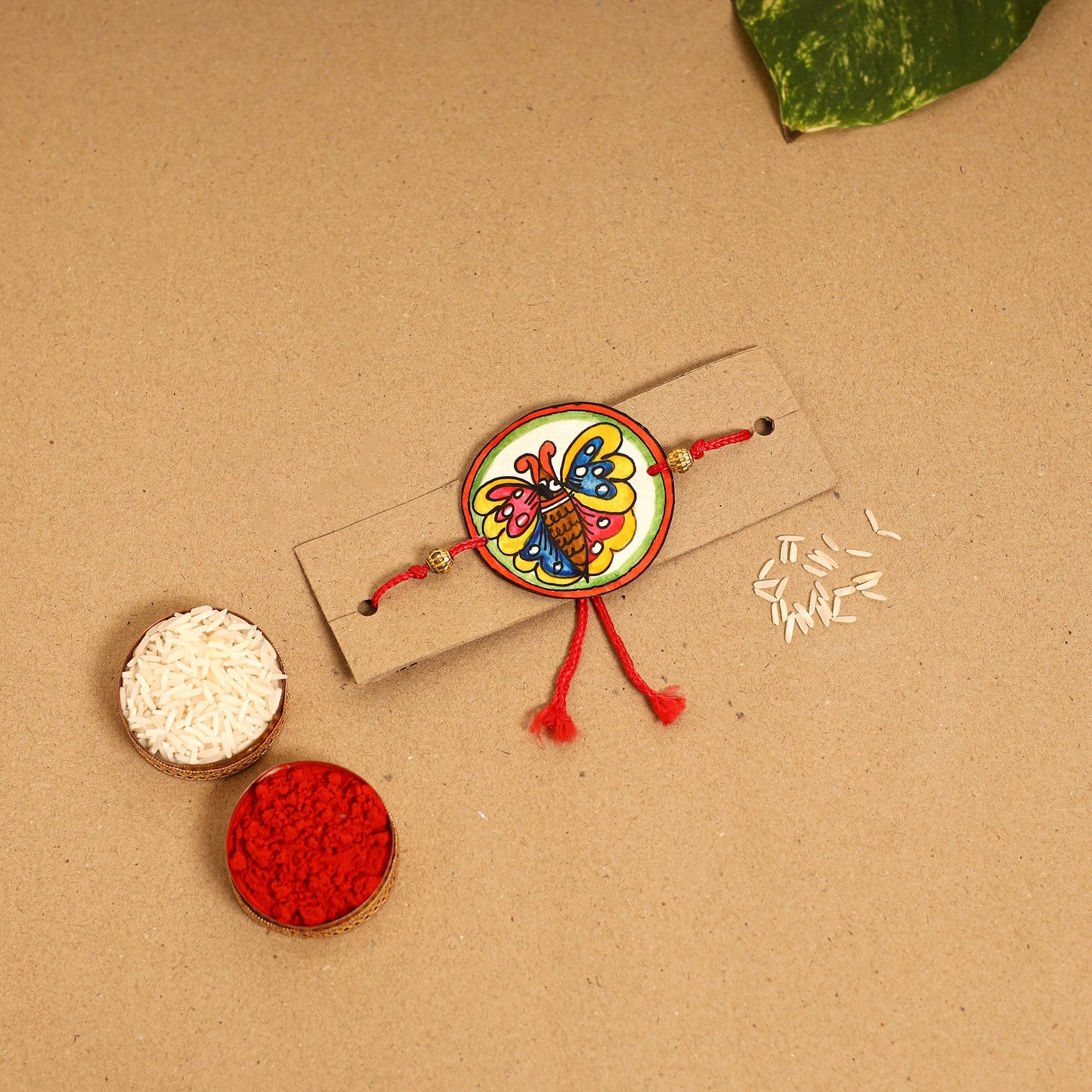  Handpainted Tholu Bommalata Leather Rakhi 