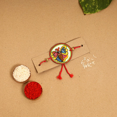  Handpainted Tholu Bommalata Leather Rakhi 
