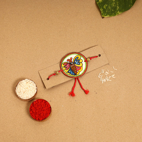  Handpainted Tholu Bommalata Leather Rakhi 
