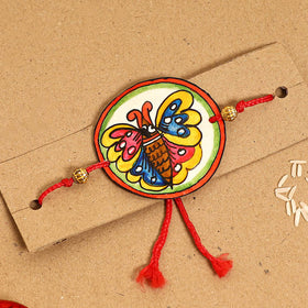  Handpainted Tholu Bommalata Leather Rakhi 