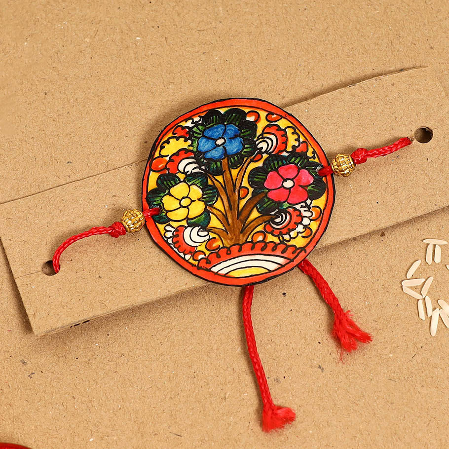  Handpainted Tholu Bommalata Leather Rakhi 