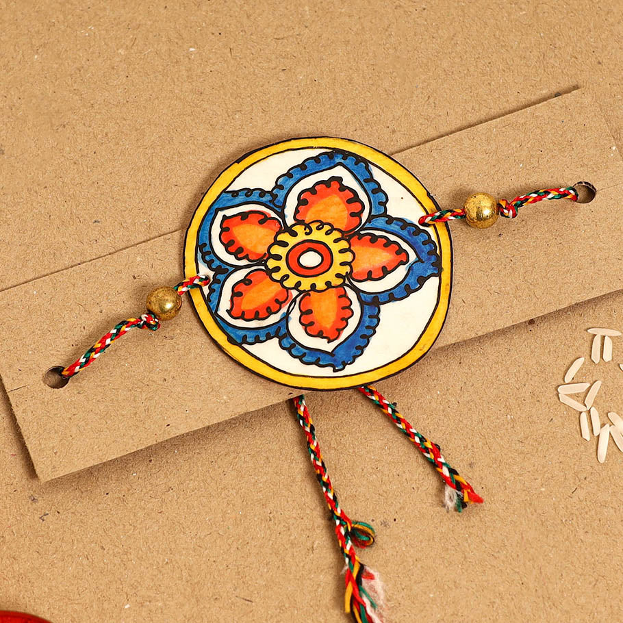  Handpainted Tholu Bommalata Leather Rakhi 