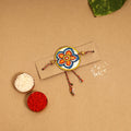  Handpainted Tholu Bommalata Leather Rakhi 