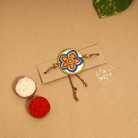  Handpainted Tholu Bommalata Leather Rakhi 