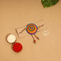  Handpainted Tholu Bommalata Leather Rakhi 
