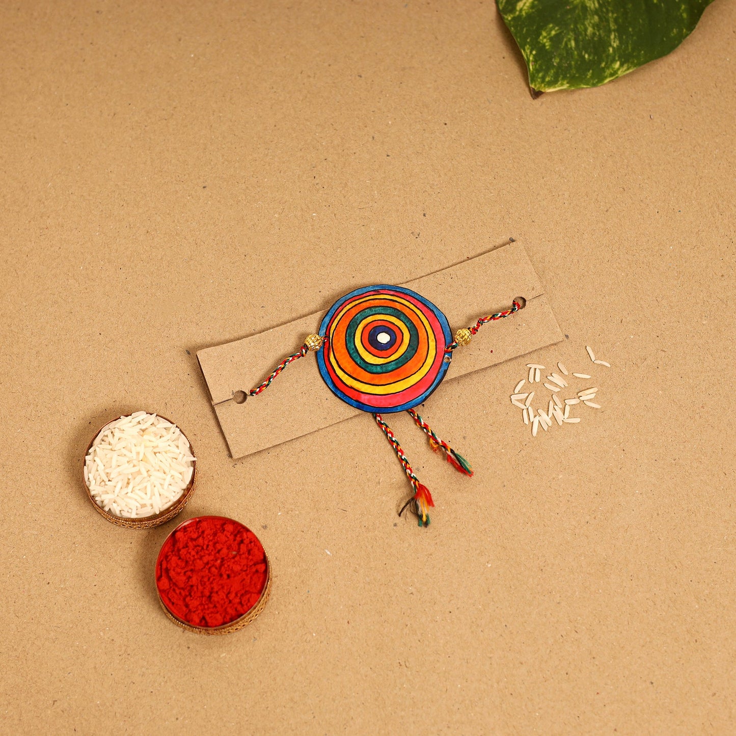  Handpainted Tholu Bommalata Leather Rakhi 