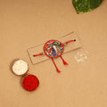 Handpainted Tholu Bommalata Leather Rakhi 