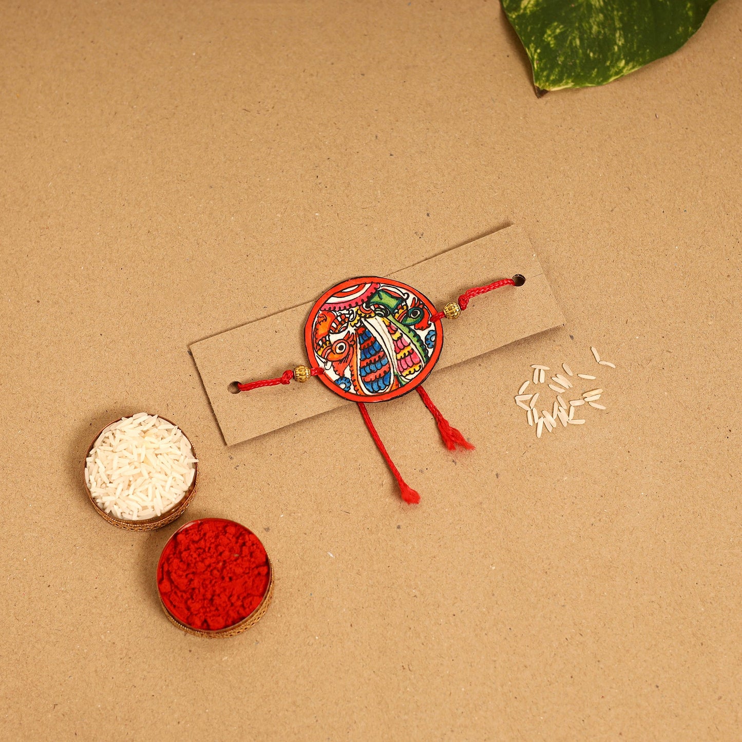  Handpainted Tholu Bommalata Leather Rakhi 