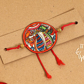  Handpainted Tholu Bommalata Leather Rakhi 