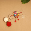  Handpainted Tholu Bommalata Leather Rakhi 