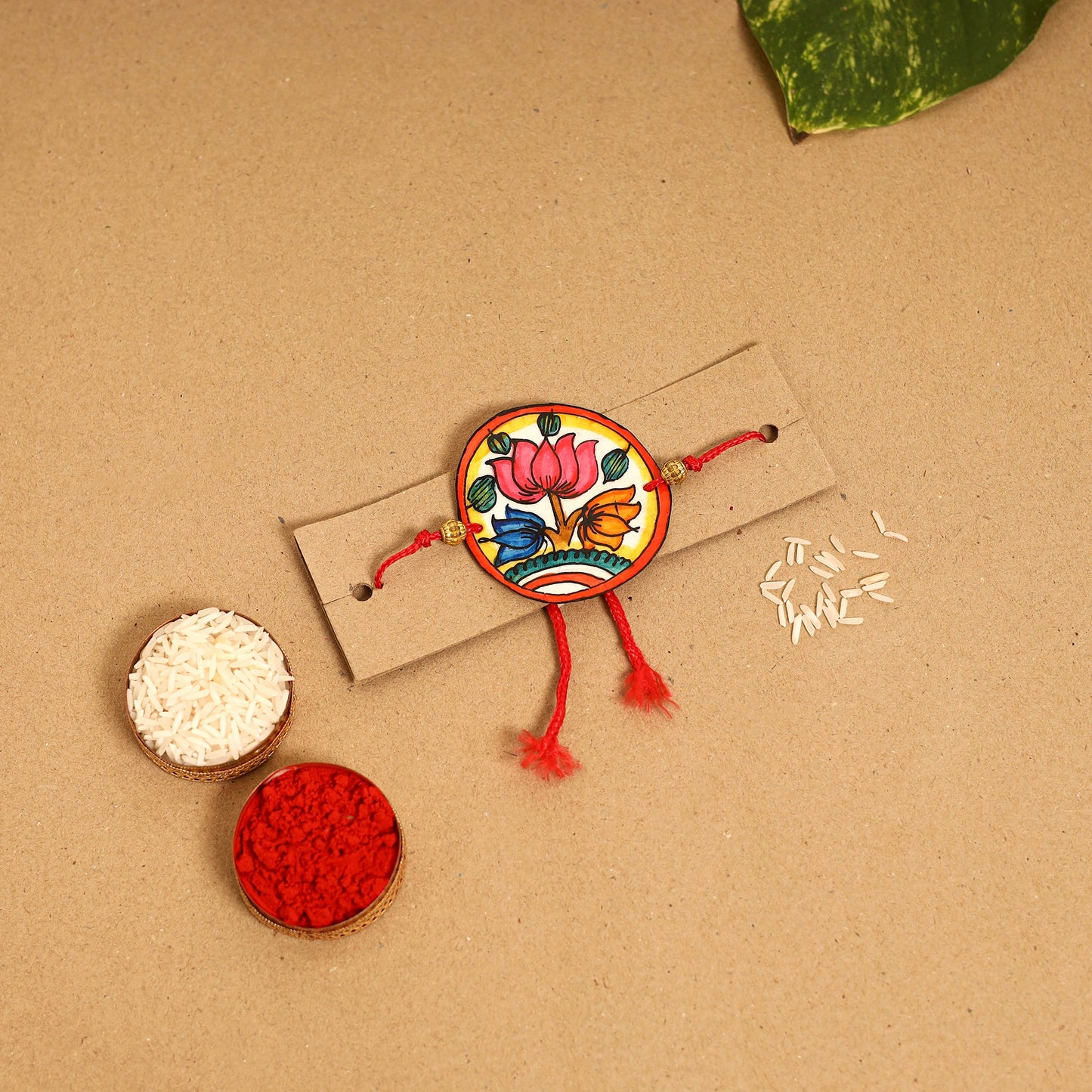  Handpainted Tholu Bommalata Leather Rakhi 