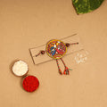  Handpainted Tholu Bommalata Leather Rakhi 