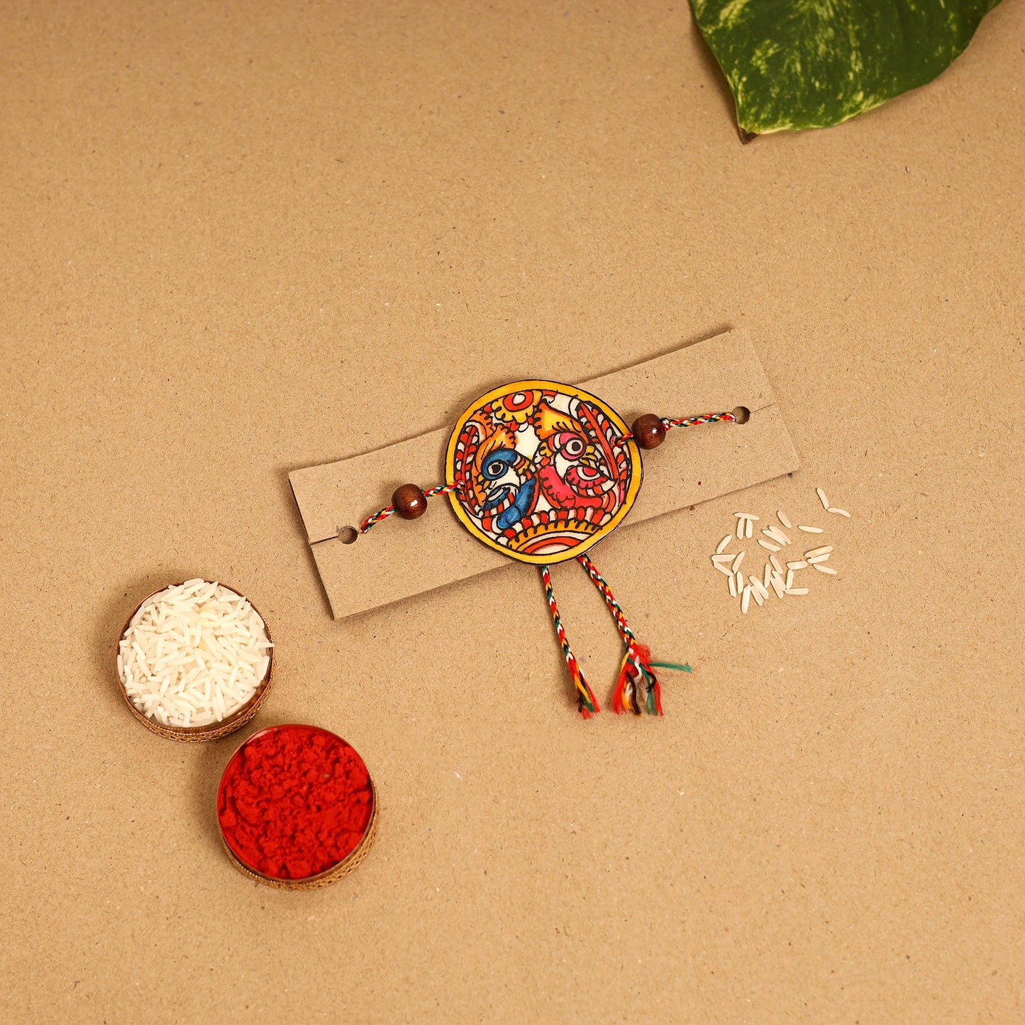  Handpainted Tholu Bommalata Leather Rakhi 