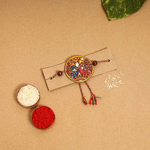  Handpainted Tholu Bommalata Leather Rakhi 