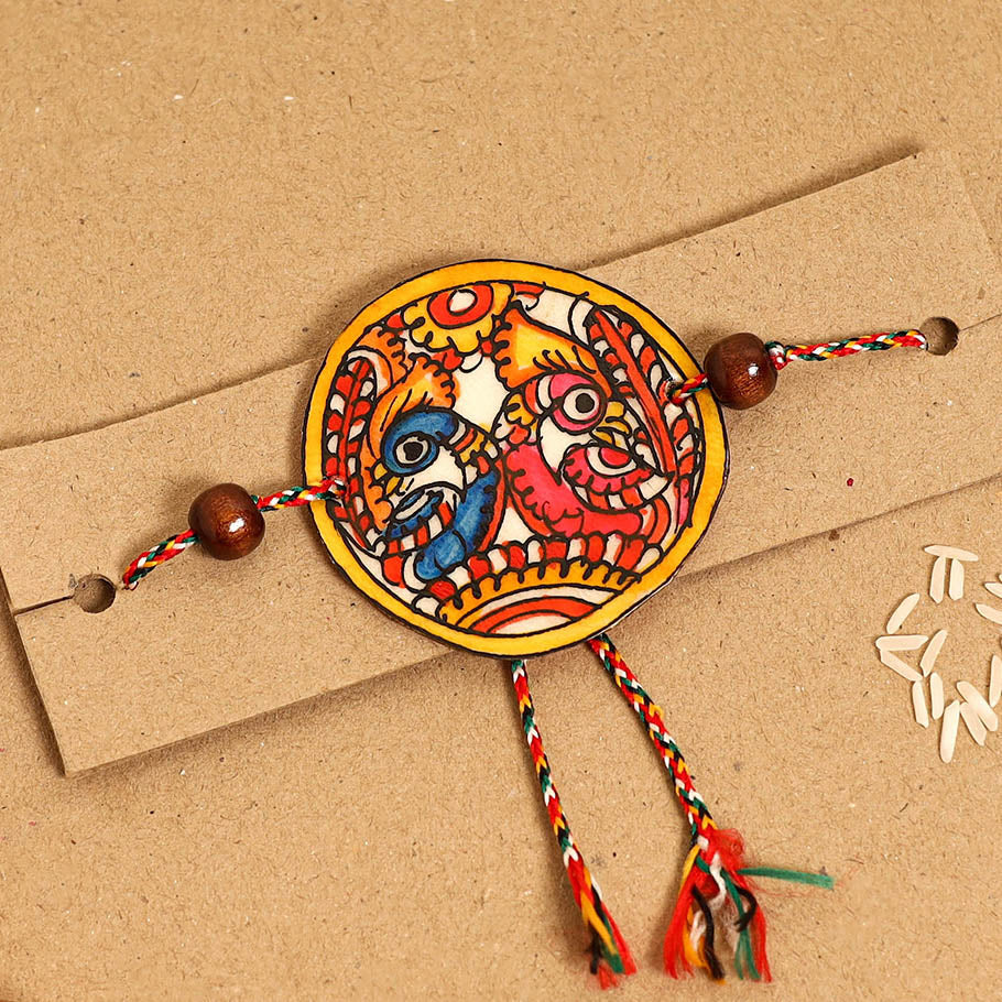  Handpainted Tholu Bommalata Leather Rakhi 