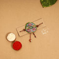  Handpainted Tholu Bommalata Leather Rakhi 