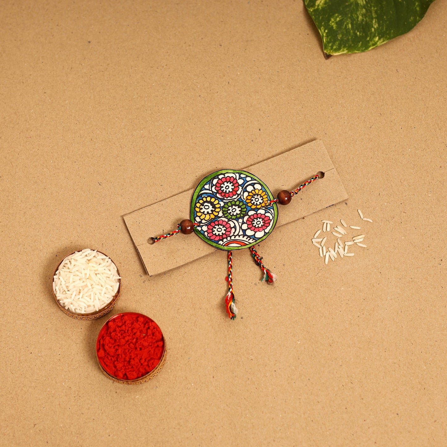  Handpainted Tholu Bommalata Leather Rakhi 