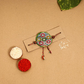  Handpainted Tholu Bommalata Leather Rakhi 