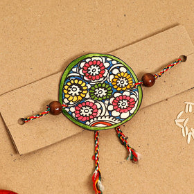  Handpainted Tholu Bommalata Leather Rakhi 