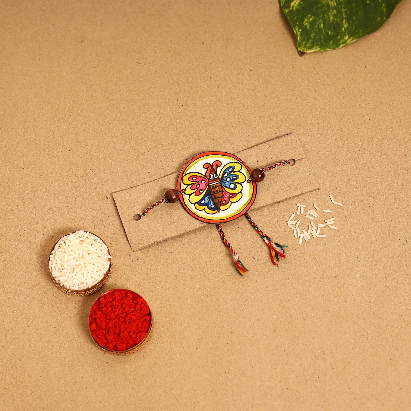  Handpainted Tholu Bommalata Leather Rakhi
