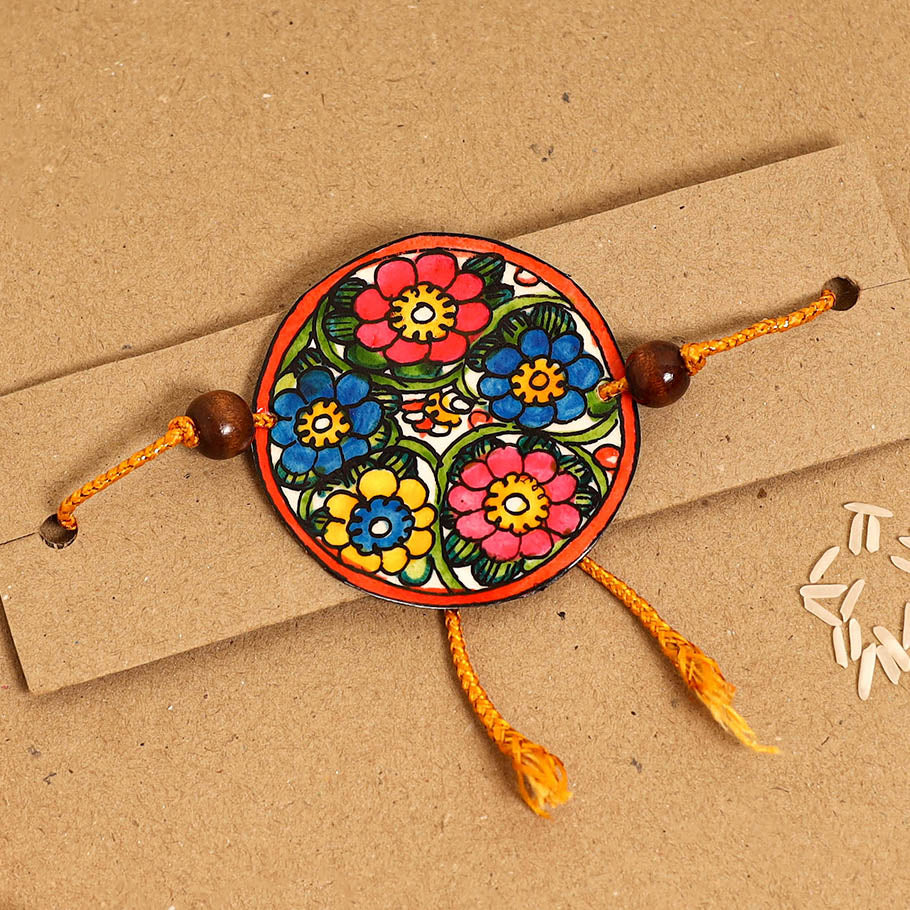  Handpainted Tholu Bommalata Leather Rakhi 