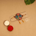  Handpainted Tholu Bommalata Leather Rakhi 