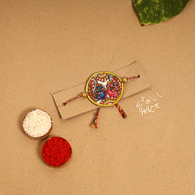  Handpainted Tholu Bommalata Leather Rakhi 