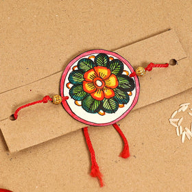 Handpainted Tholu Bommalata Leather Rakhi 