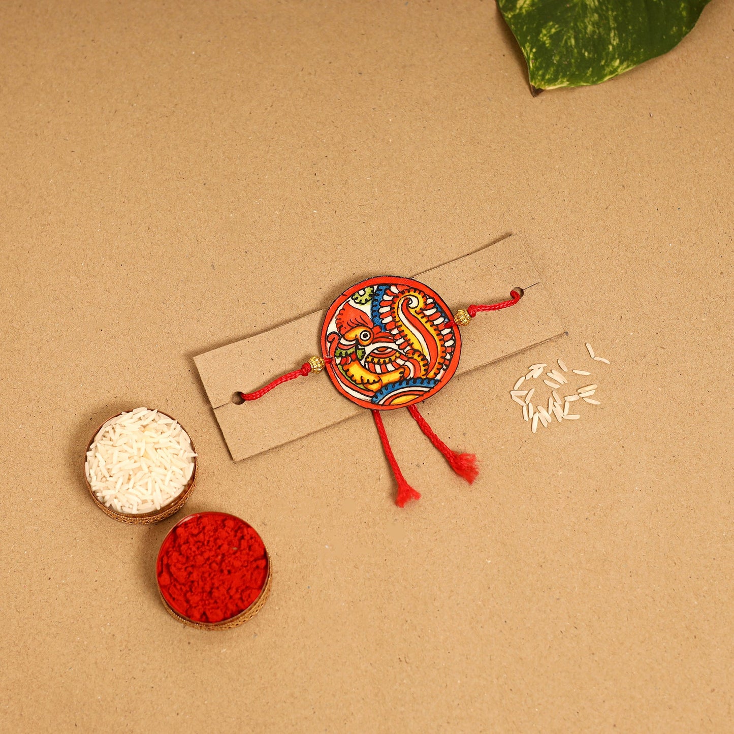  Handpainted Tholu Bommalata Leather Rakhi 