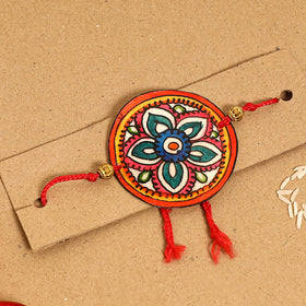  Handpainted Tholu Bommalata Leather Rakhi 