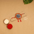  Handpainted Tholu Bommalata Leather Rakhi 