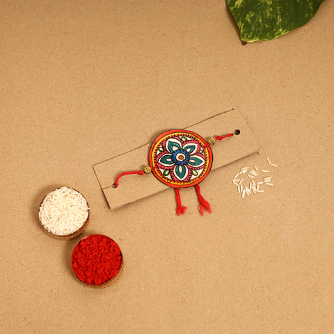  Handpainted Tholu Bommalata Leather Rakhi 