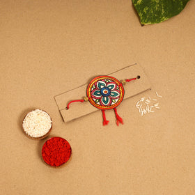  Handpainted Tholu Bommalata Leather Rakhi 