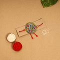  Handpainted Tholu Bommalata Leather Rakhi 