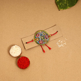  Handpainted Tholu Bommalata Leather Rakhi 