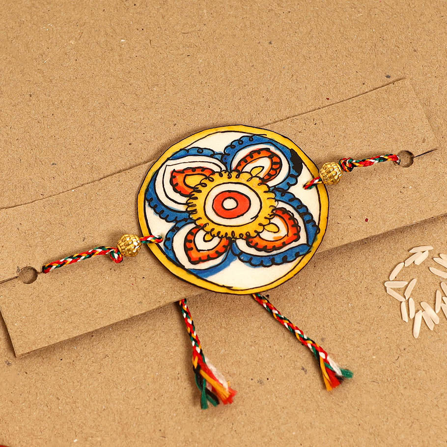  Handpainted Tholu Bommalata Leather Rakhi 