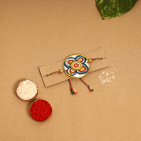  Handpainted Tholu Bommalata Leather Rakhi 