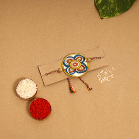  Handpainted Tholu Bommalata Leather Rakhi 