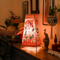 Handpainted Tholu Bommalata Leather Table Lamp (Big), lit in a home in the evening, AI visual of the light, iTokri